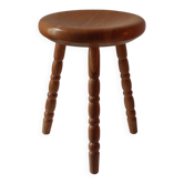 Tabouret en bois tourné vintage du milieu du siècle avec un siège épais.