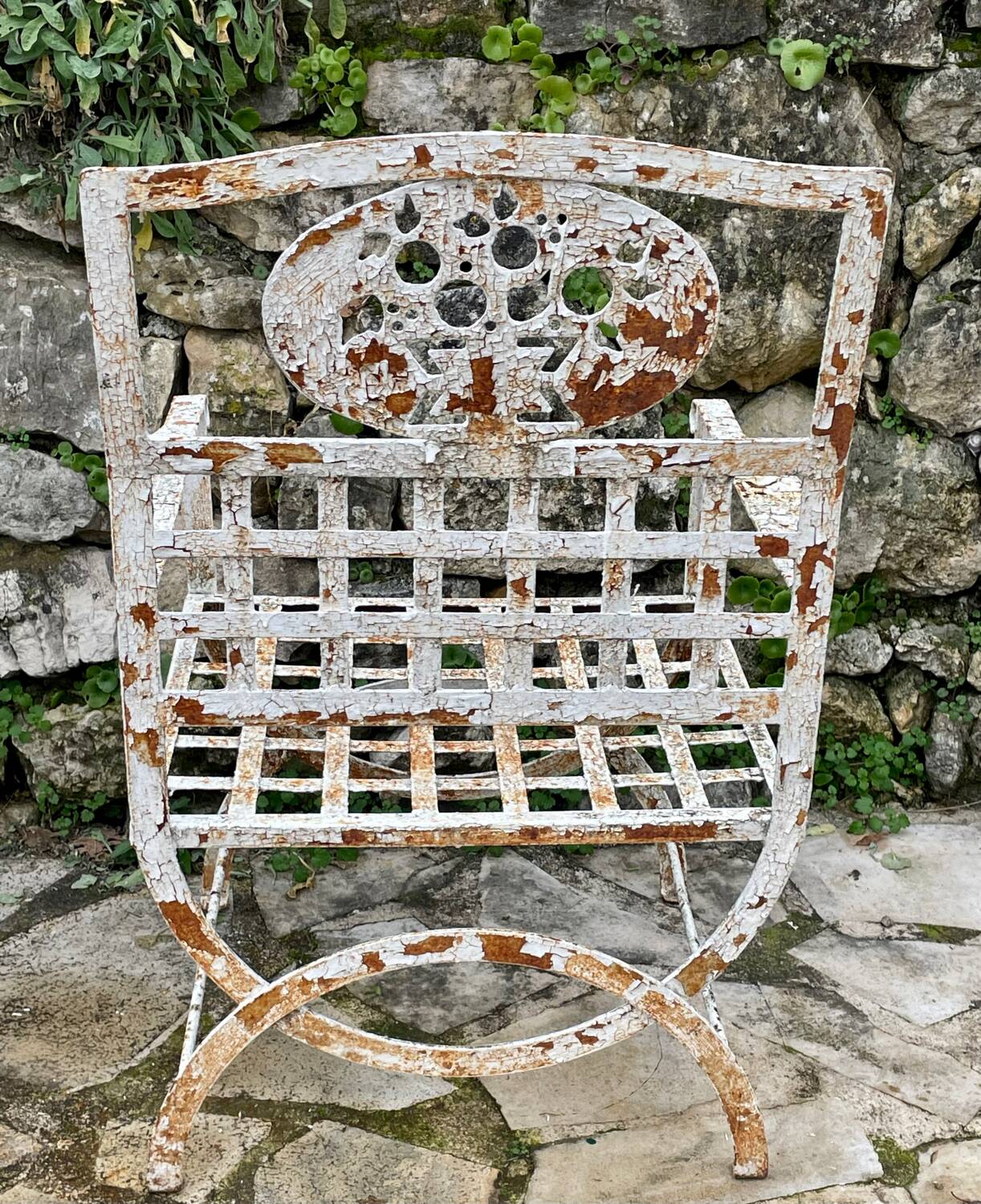 Pair of wrought iron armchairs