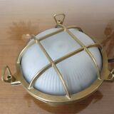 Brass porthole wall lamp