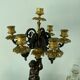 Candelabra with cherub in patinated bronze