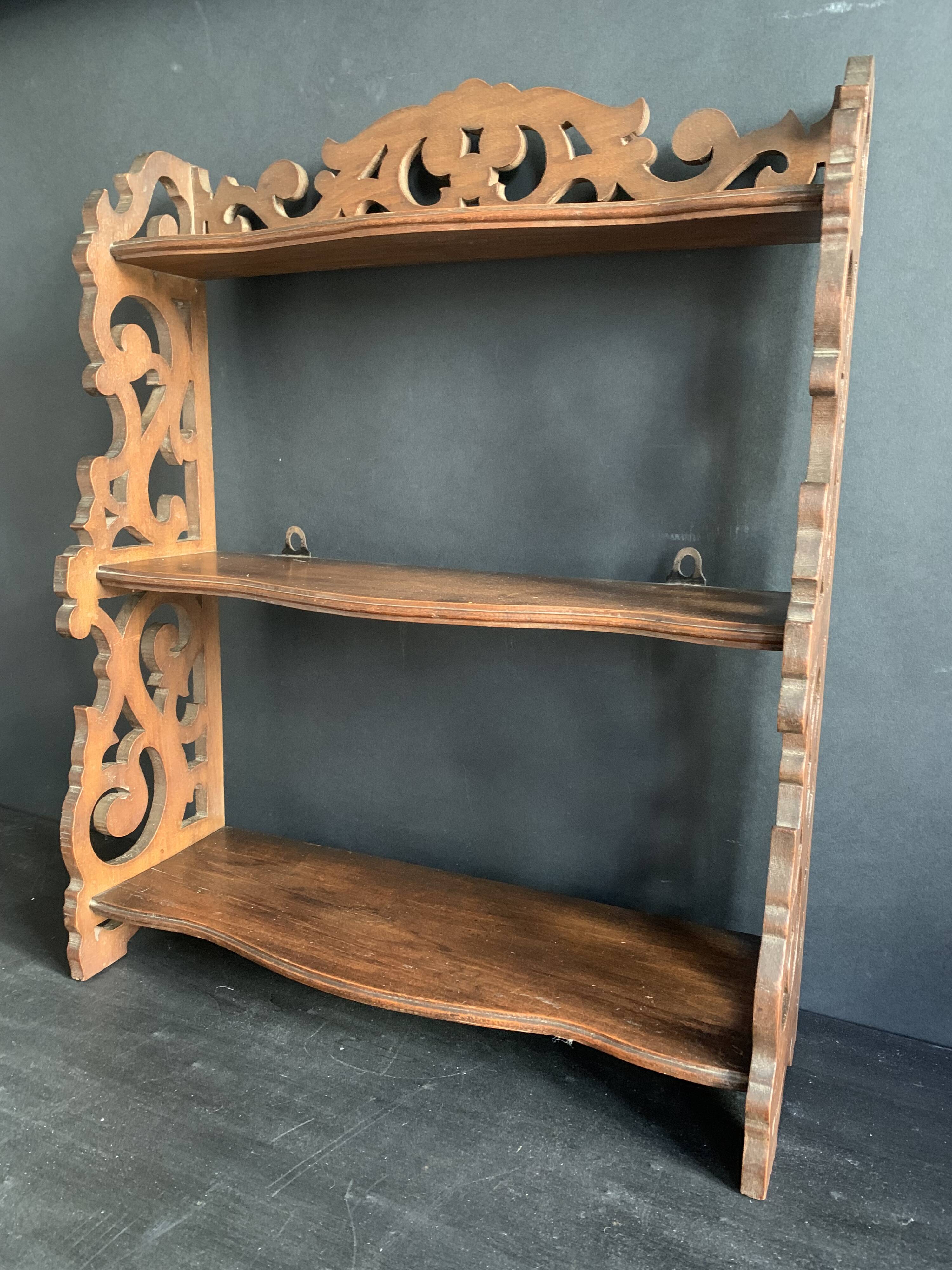 Antique shelf with openwork wooden pediment, early 20th century