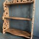 Antique shelf with openwork wooden pediment, early 20th century