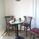 Set of 19 vintage wooden bistro chairs with red faux leather.