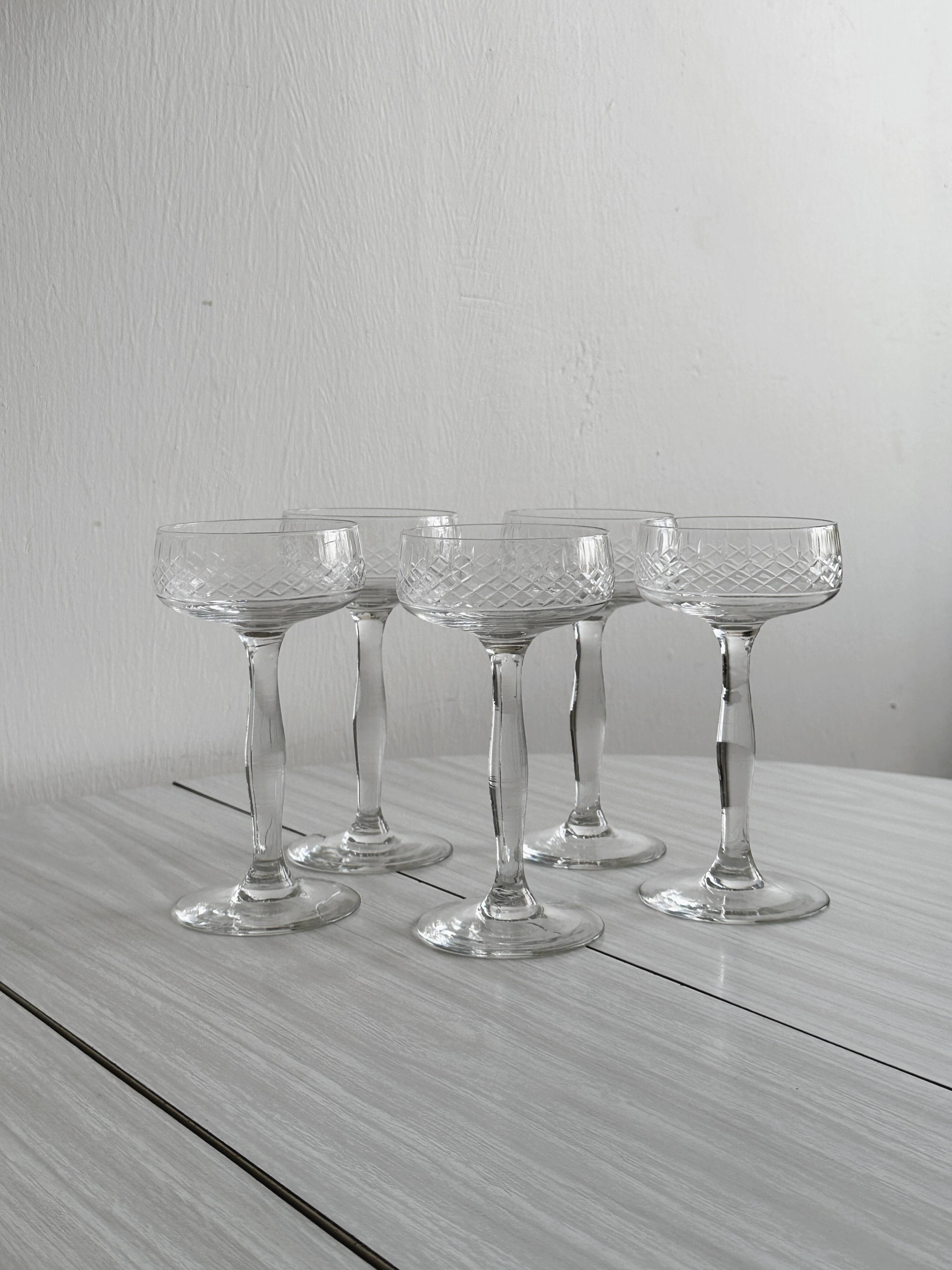 5 chiseled glass cocktail glasses.