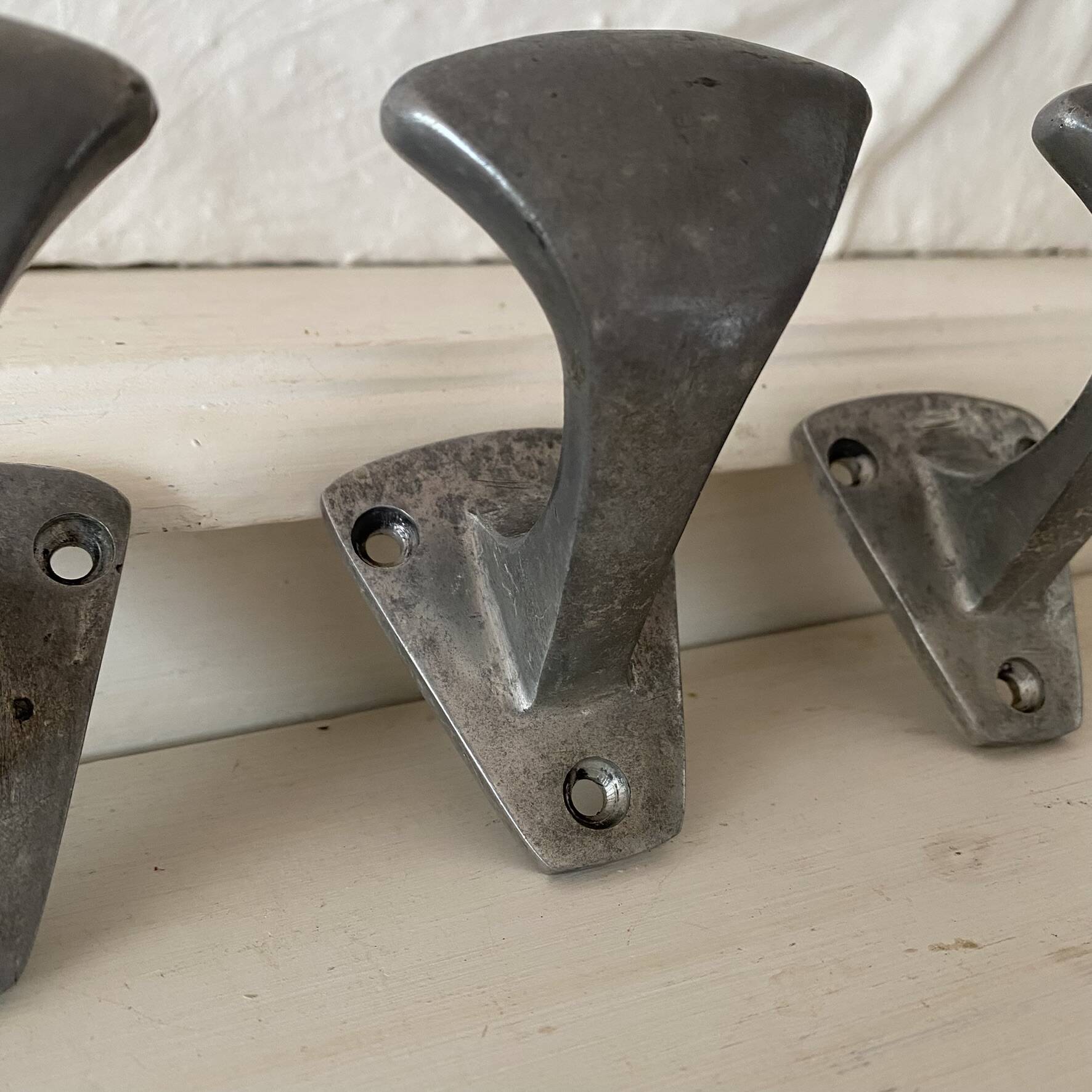 Set of 3 vintage steel hooks from a school.