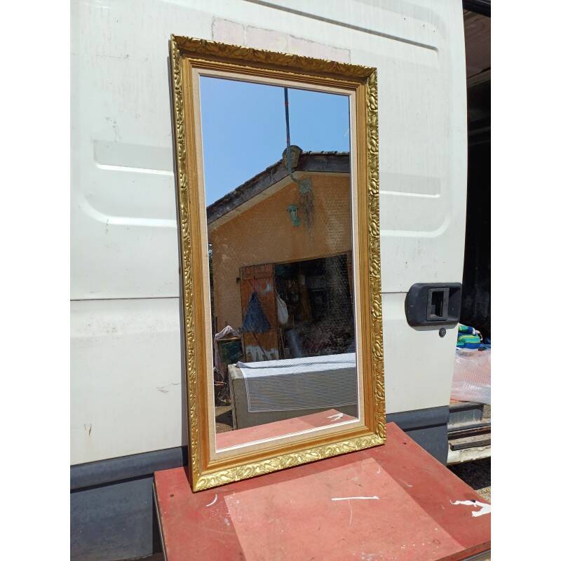 Wooden mirror and gold trim