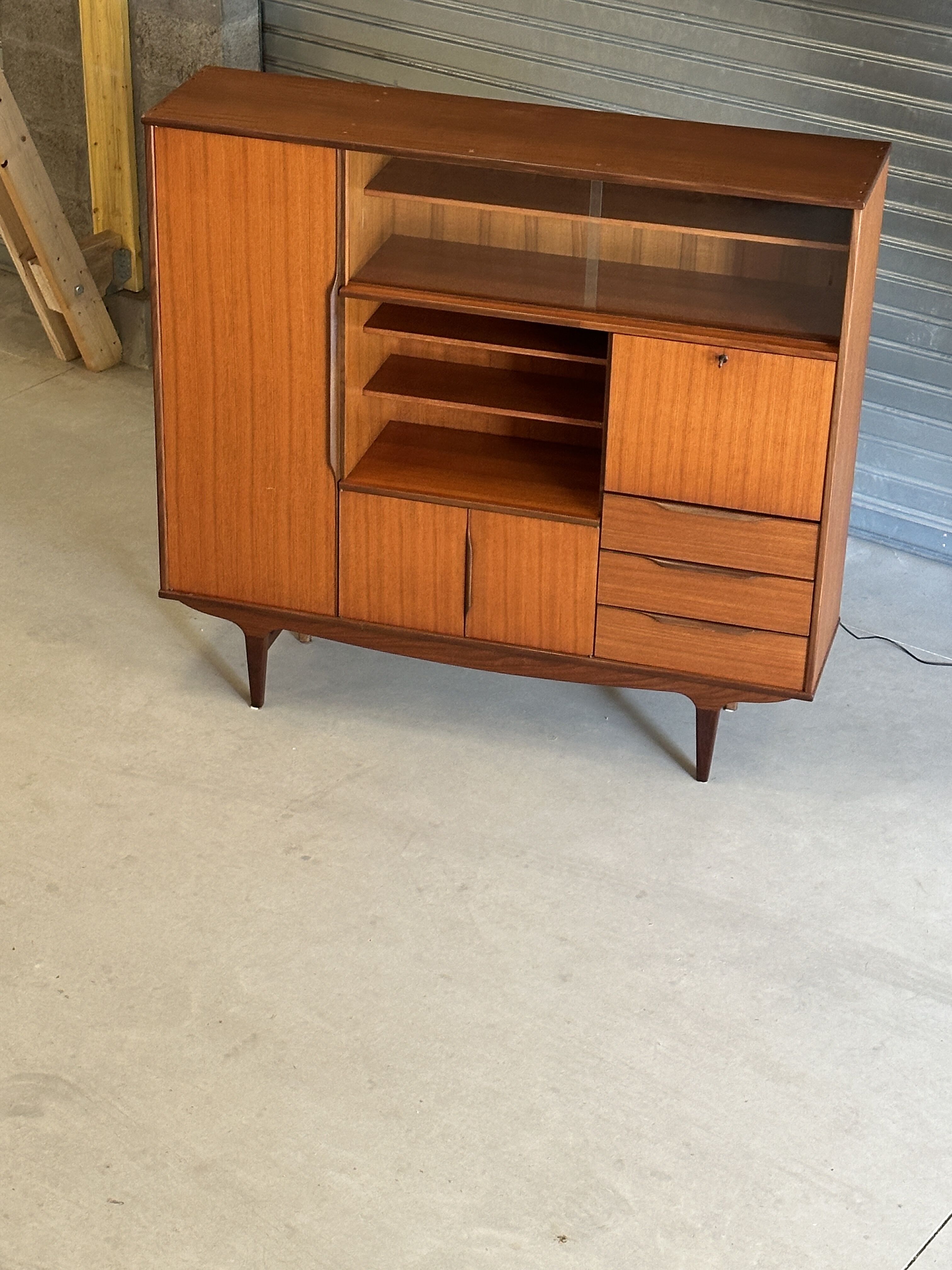 Very beautiful Scandinavian highboard in teak from the 1960s.
