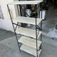 Industrial-style shelf in light wood and cast iron