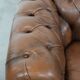 Brown cowhide leather chesterfield armchair  in English style on wheels