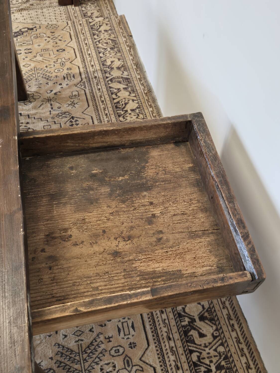 Rustic farmhouse coffee table from the 1900s with two drawers.