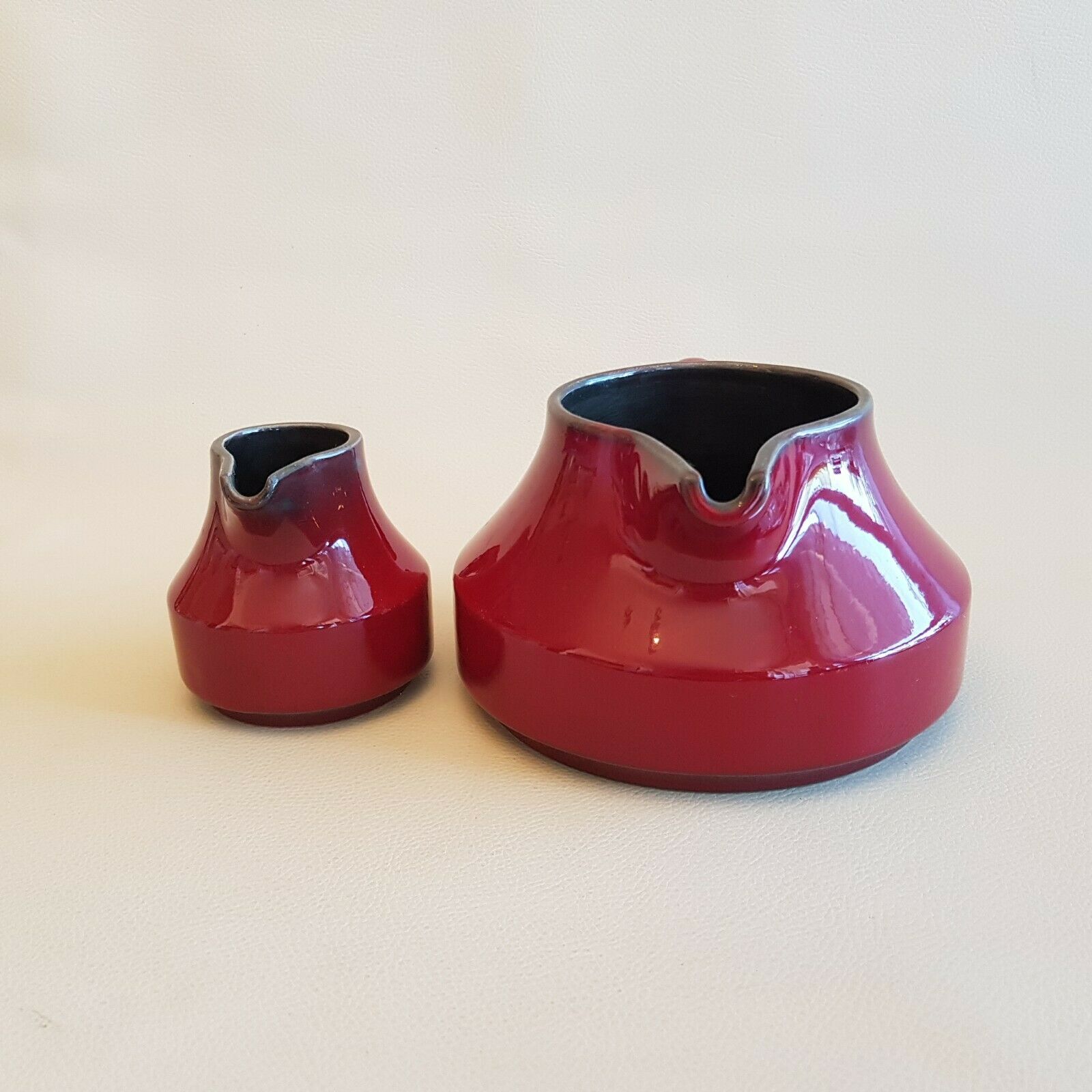 Teapot and milk jar in burgundy red ceramic