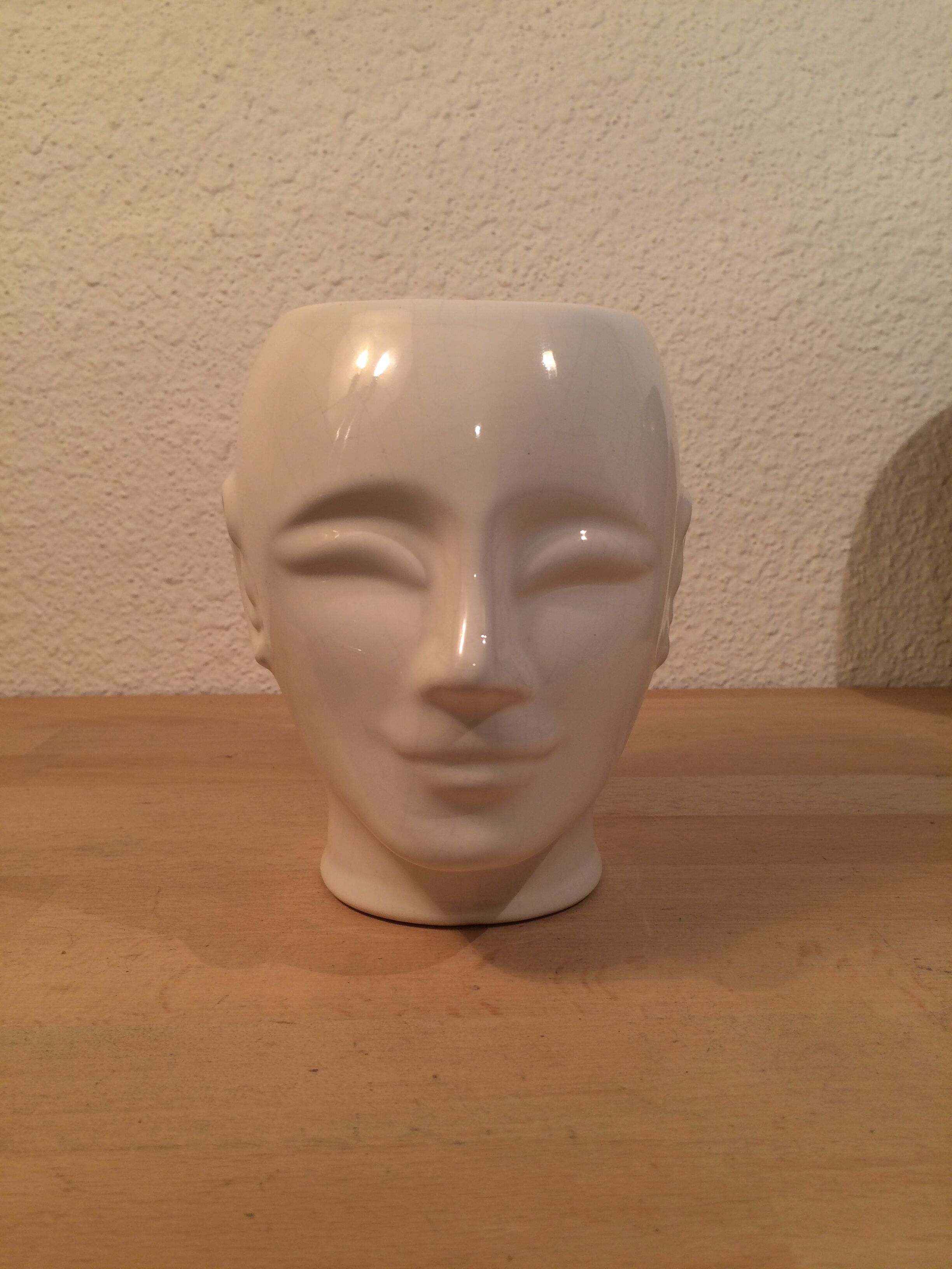 2 black and white ceramic head vases, face