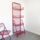 Red mesh metal grocery shelf