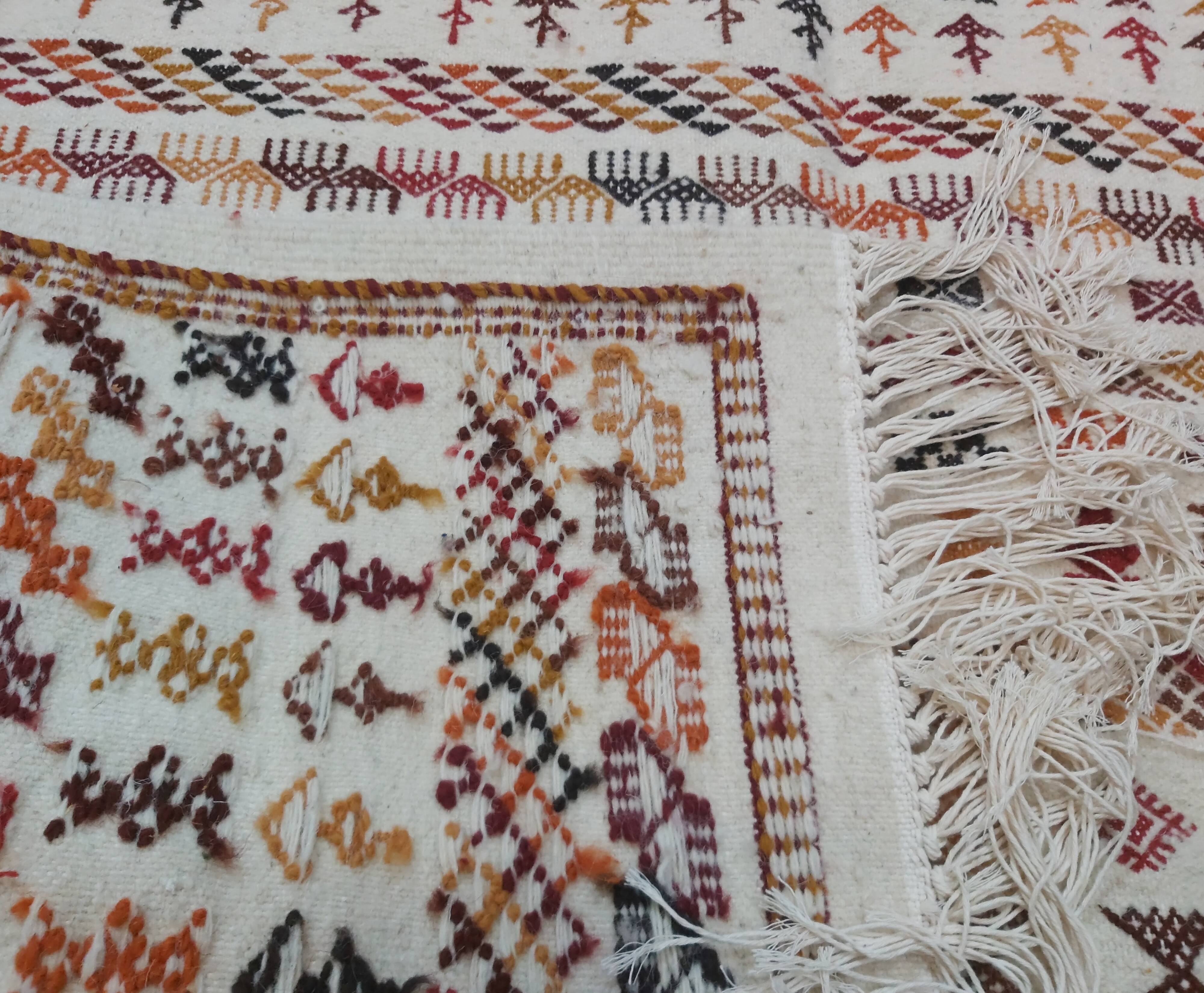 White carpet with multicolored Berber patterns