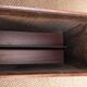 Danish magazine rack in rosewood and leather, 1960.