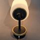 Pair of wall lights in gilded brass, black metal and opaline, 1960