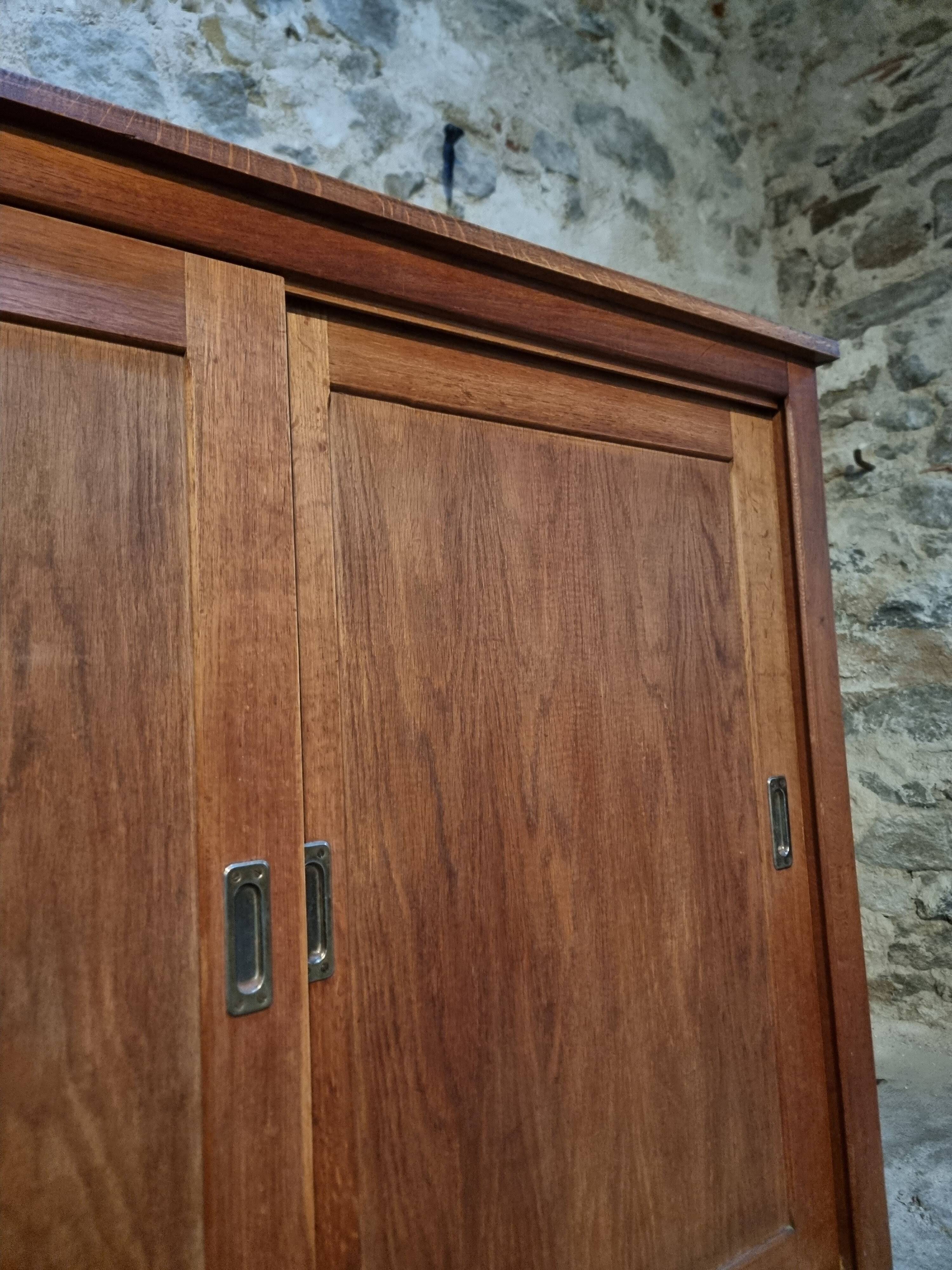 Oak sliding door wardrobe, 1920s