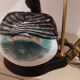 Decorative table lamp with a sculpted duck-shaped base and painted finish.