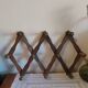 Old wooden accordion-shaped coat hook