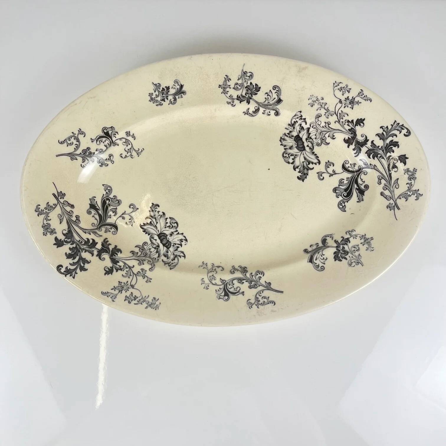 Large oval ironstone dish, "Damas" pattern by Sarreguemines, late 19th century, grey-black.