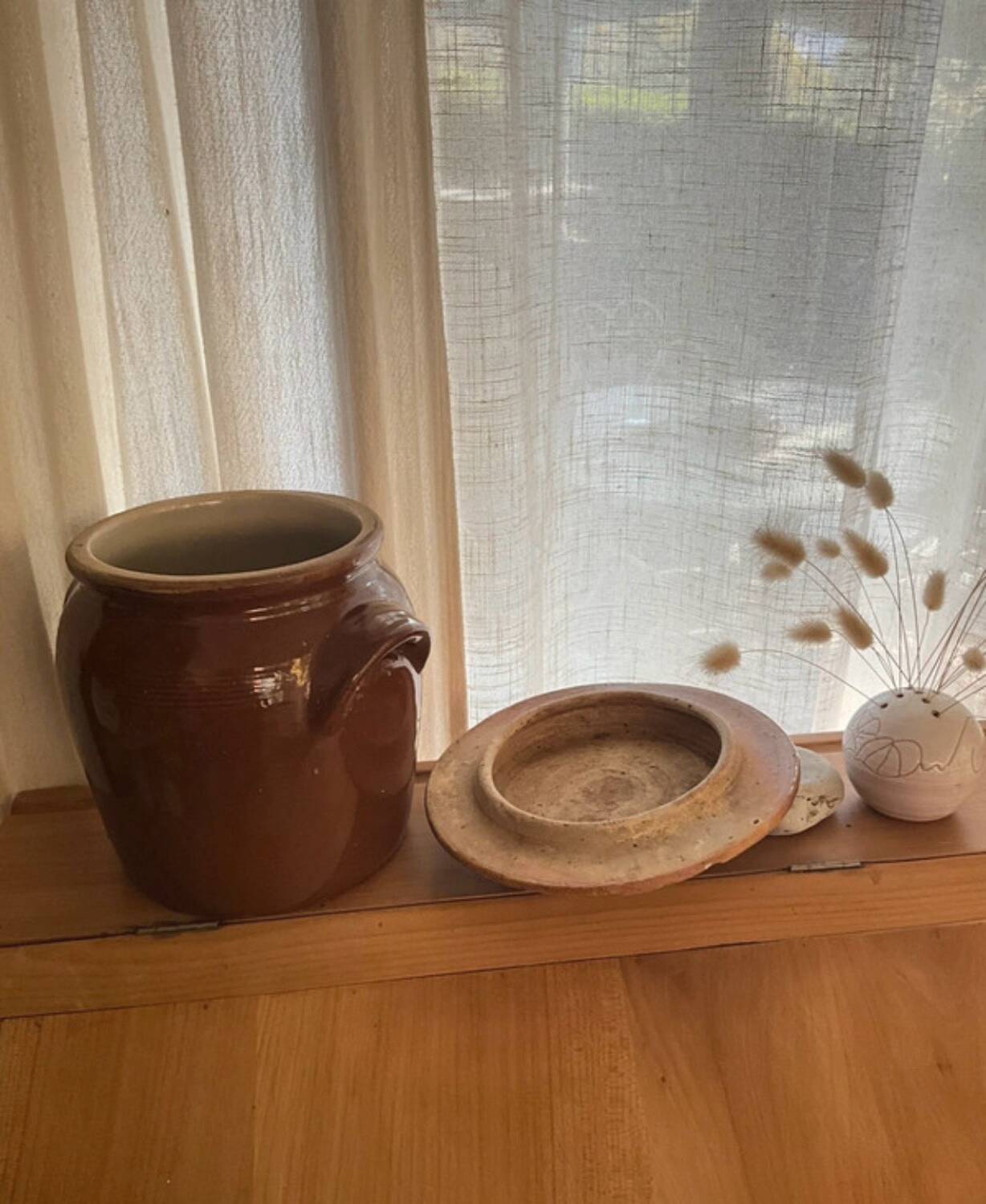 Ancient ceramic salt cellar and its lid.