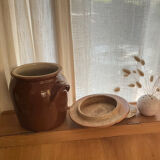 Ancient ceramic salt cellar and its lid.