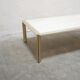 Table basse vintage en travertin et laiton