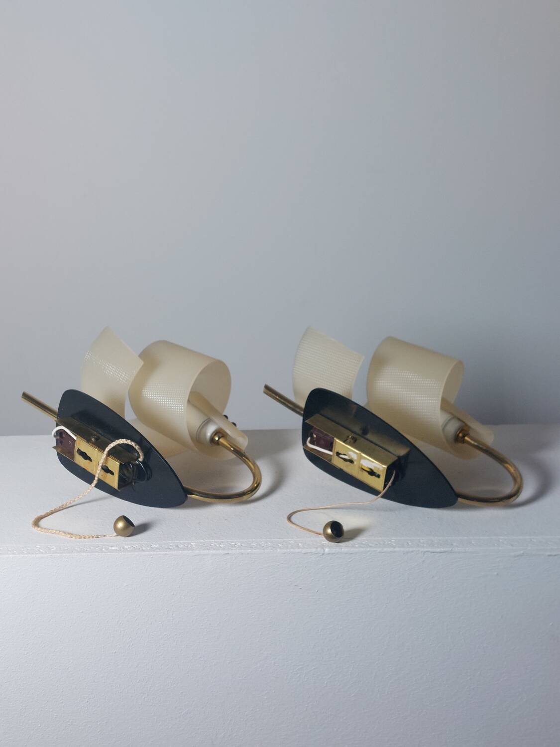 Pair of vintage wall lamps from the 1950s in brass.