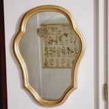 Free form mirror in golden wood