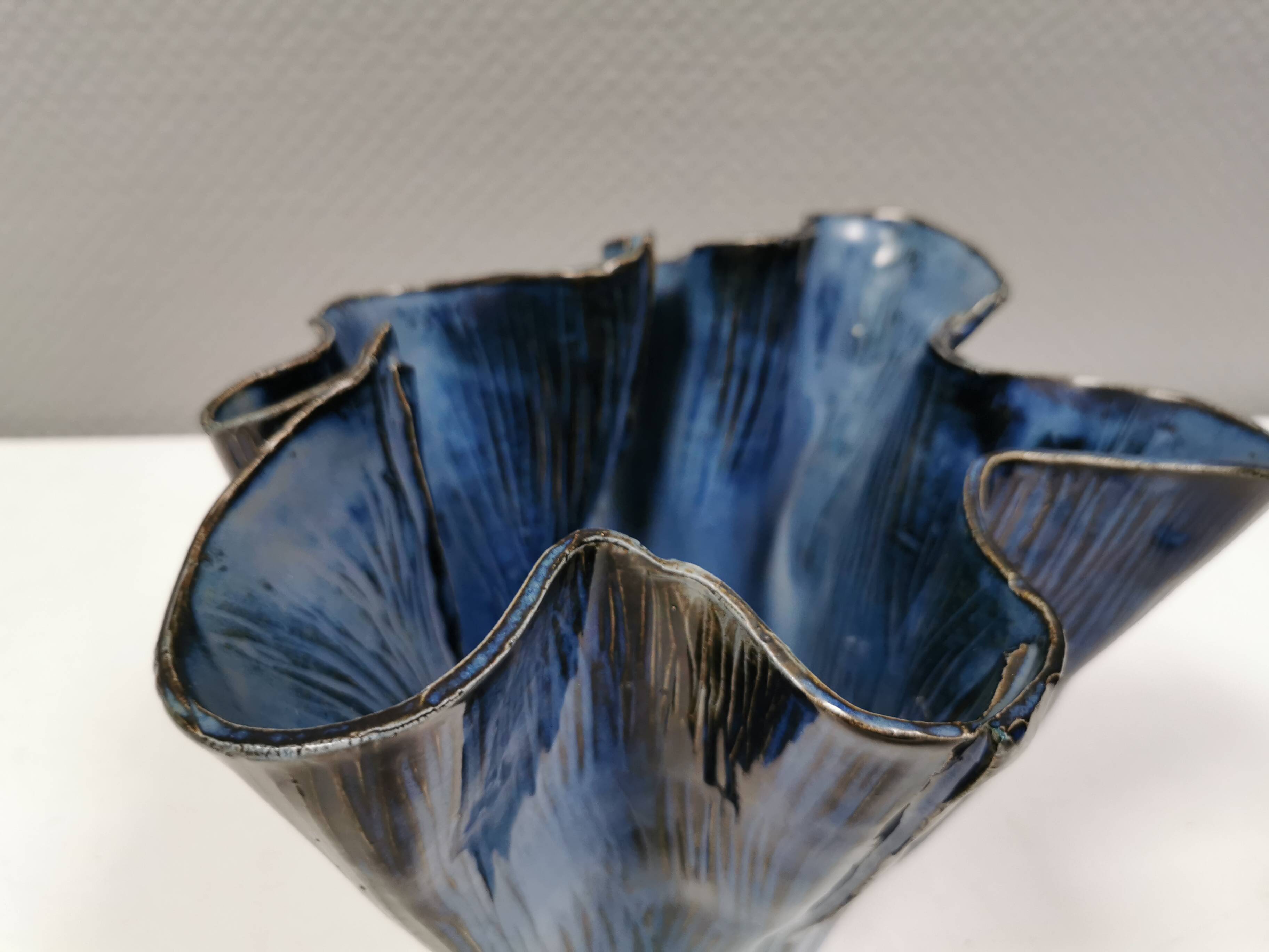 Very special vase in “folded” bluish glazed clay.