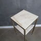 Marble pedestal table and brass hollywood regency