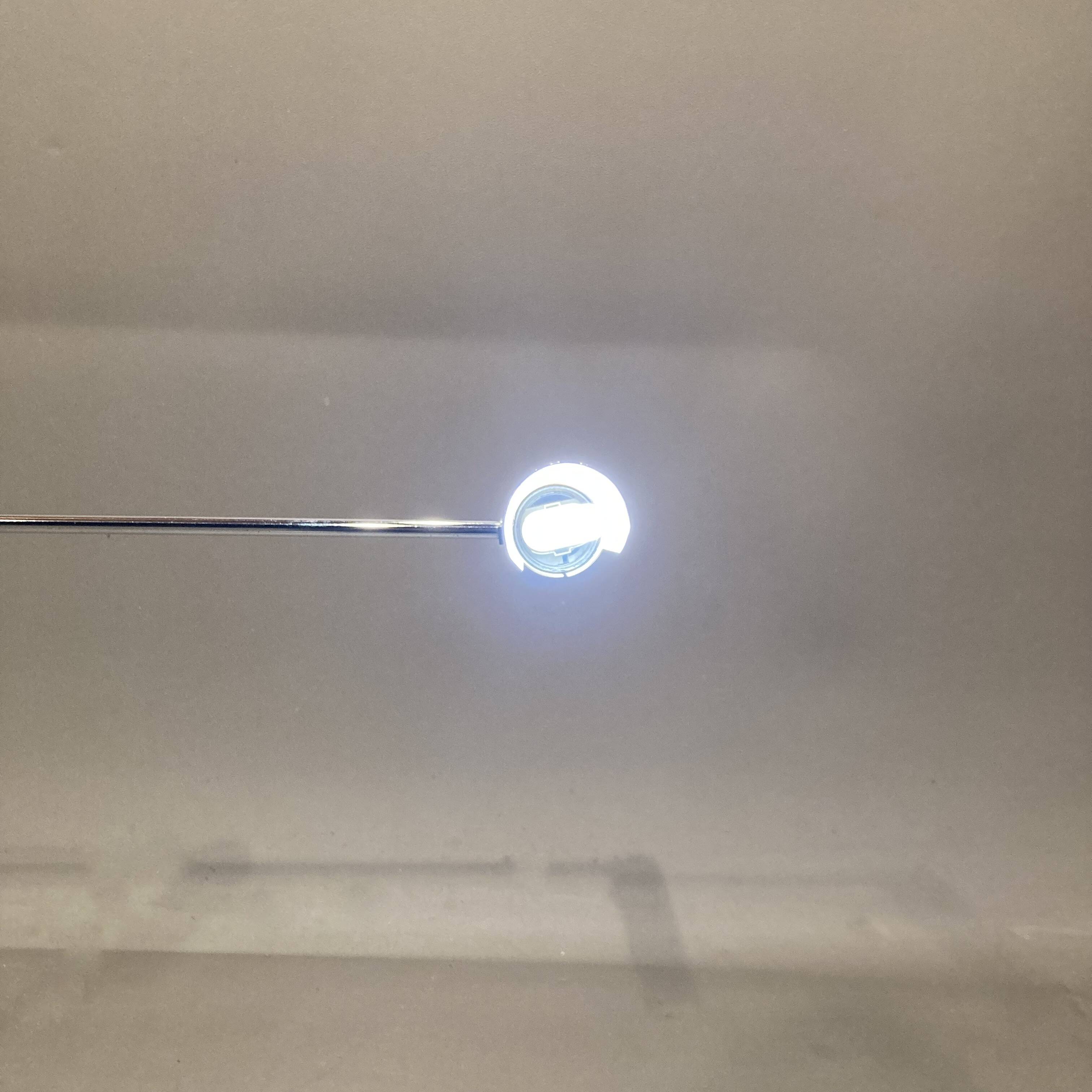 Large modular chrome lamp.