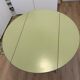 Round extendable folding Formica table with metal legs from the 50s/60s in green.