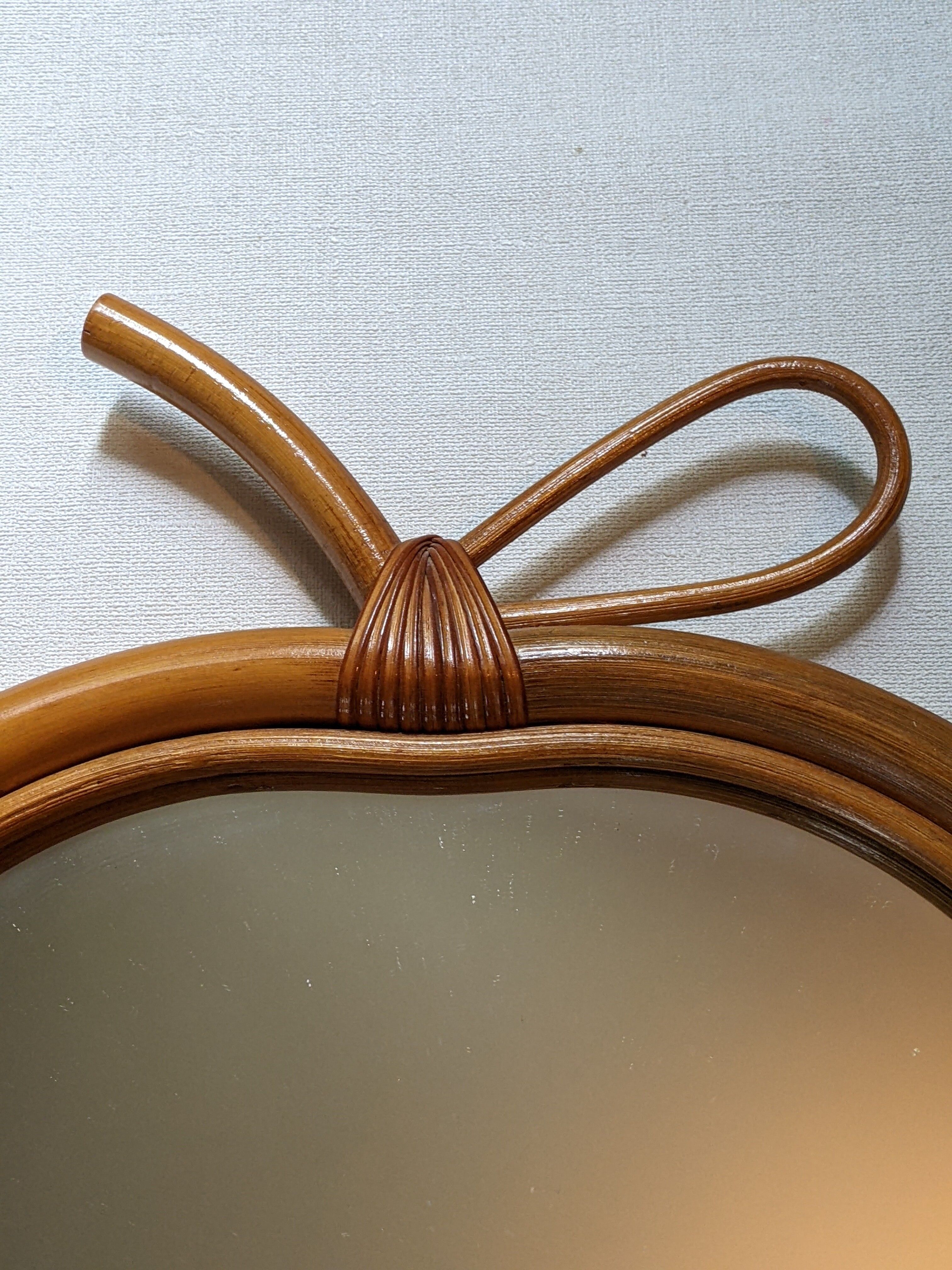 Vintage apple mirror in bamboo rattan from the 70s.