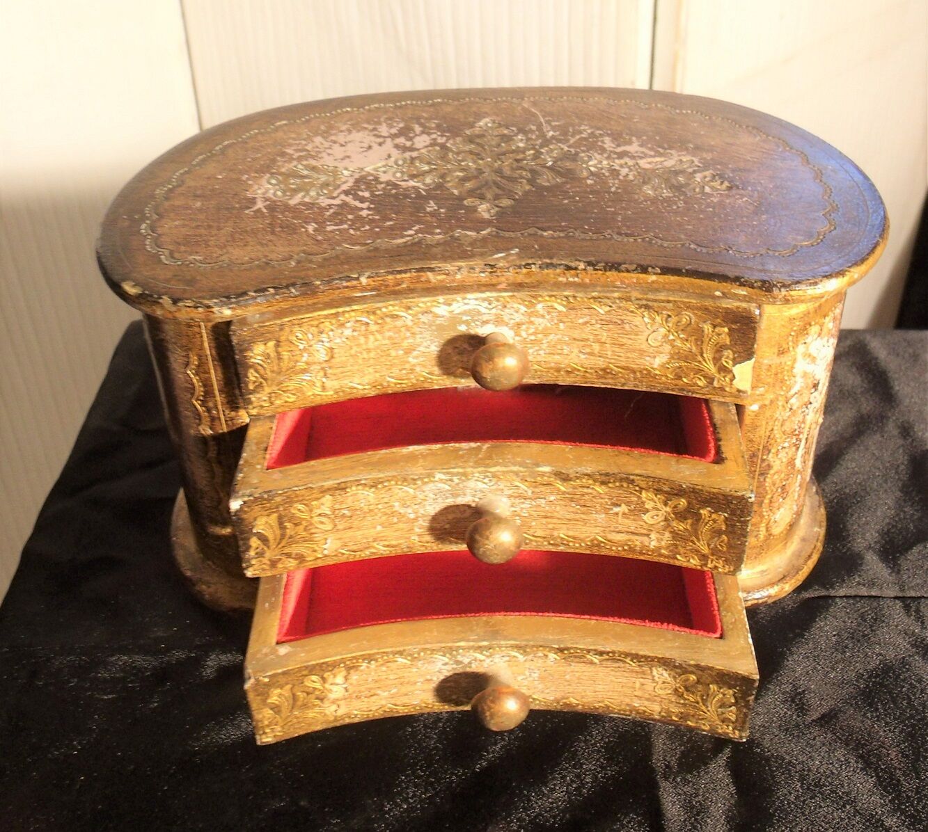 Jewelry box with gilded wooden drawers