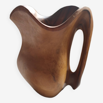 Olive wood pitcher.