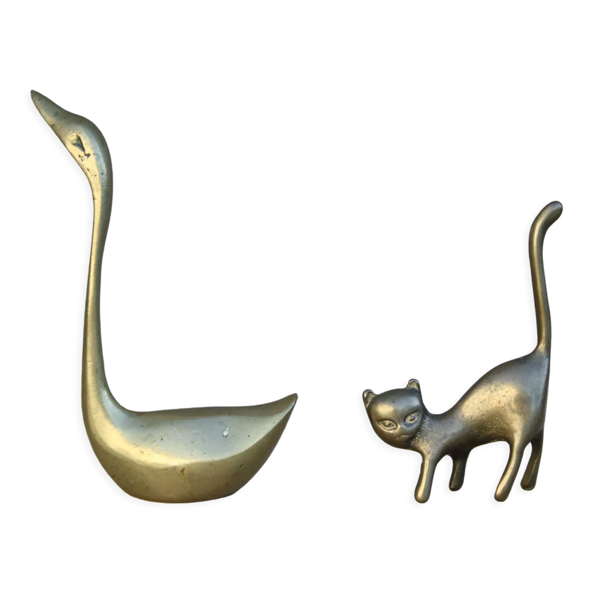 Cat and brass swan