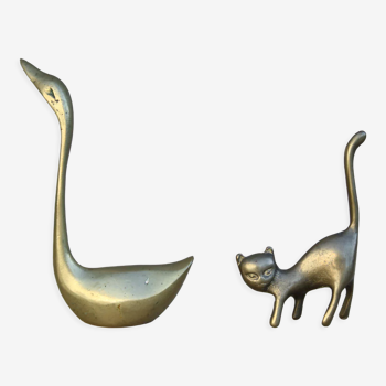 Cat and brass swan