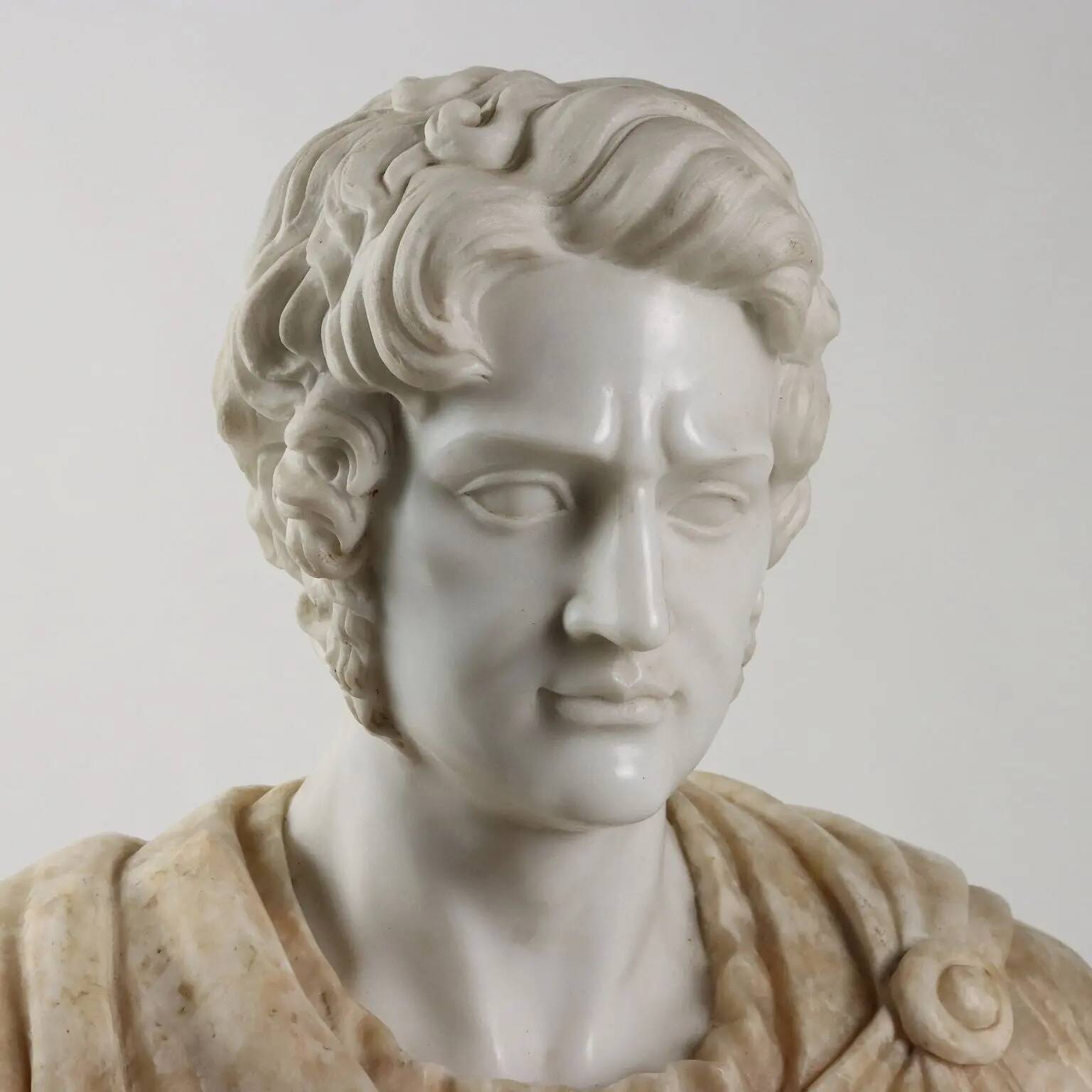 Bust of a Roman emperor in white marble, Italy, 20th century.