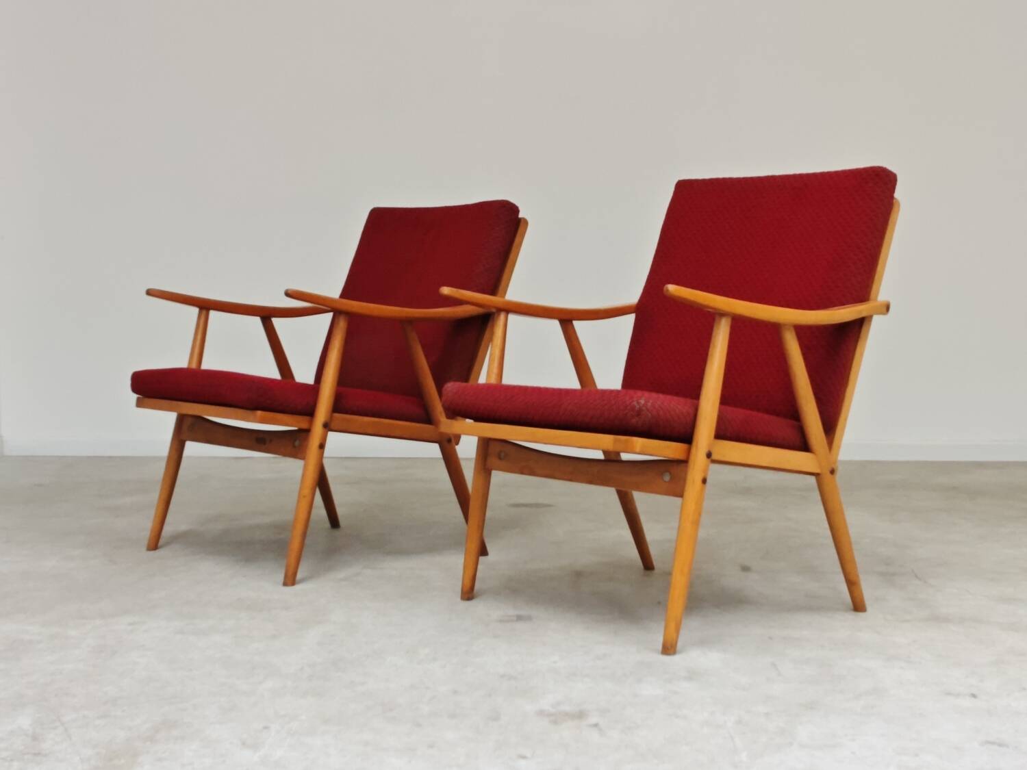 Pair of red Boomerang armchairs by Antonin Suman for Ton Bystrice Thonet