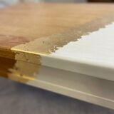 Coffee table with pin legs and gold leaf