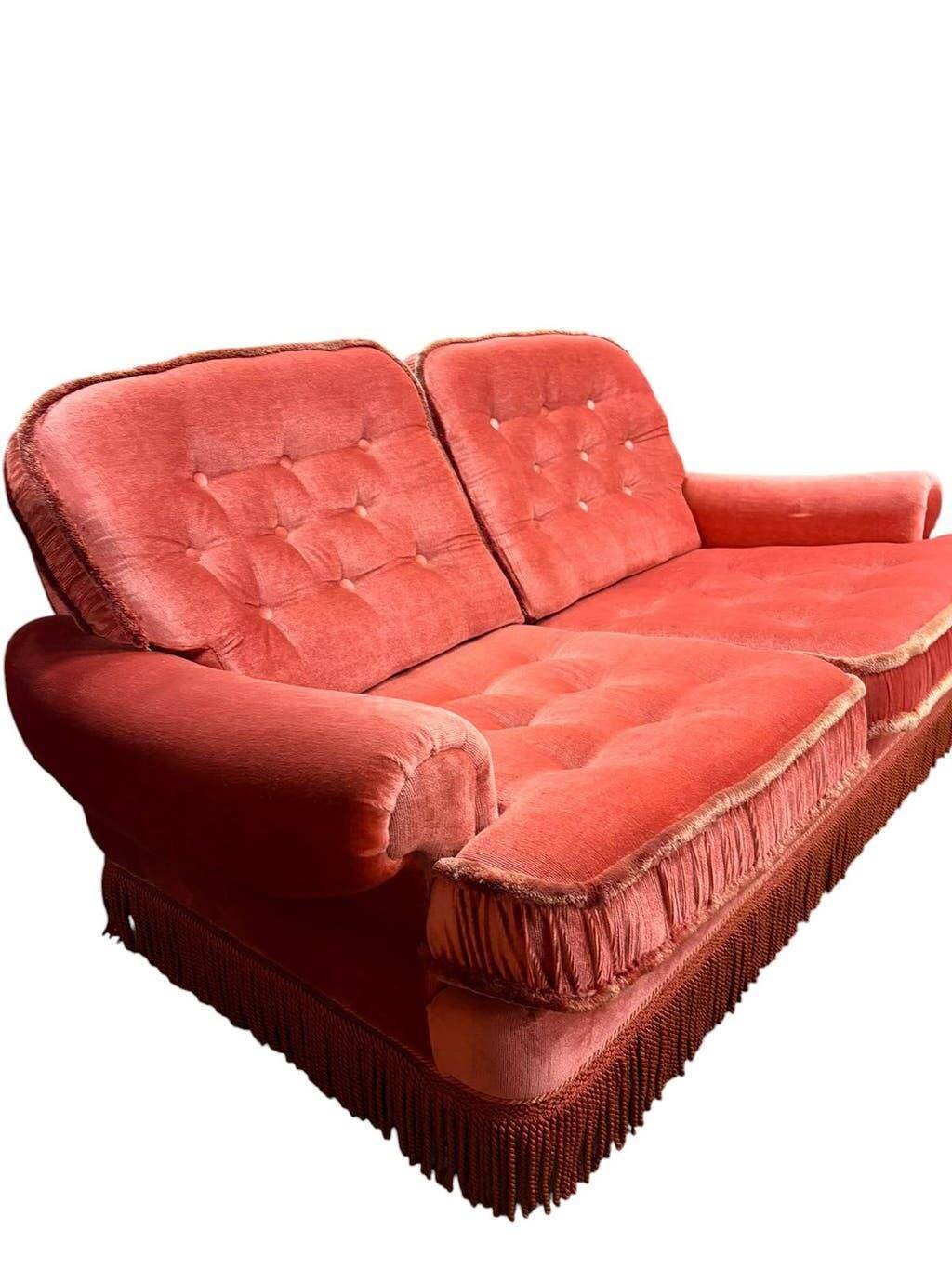Vintage pink two-seater sofa with fringes