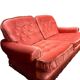 Vintage pink two-seater sofa with fringes