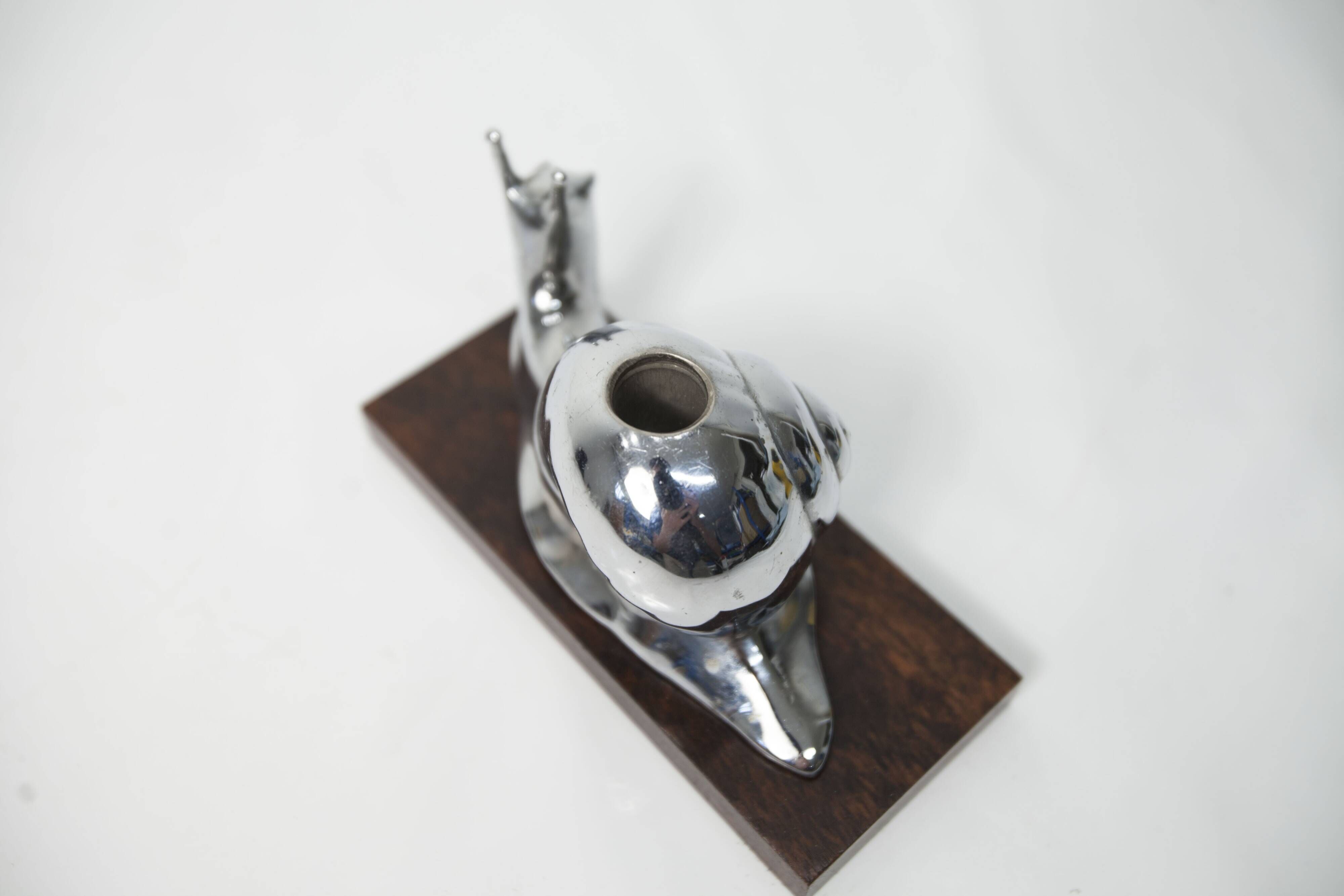 Silver snail candlestick on a teak base 1960