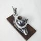 Silver snail candlestick on a teak base 1960