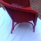 Fauteuil vintage en rotin rouge