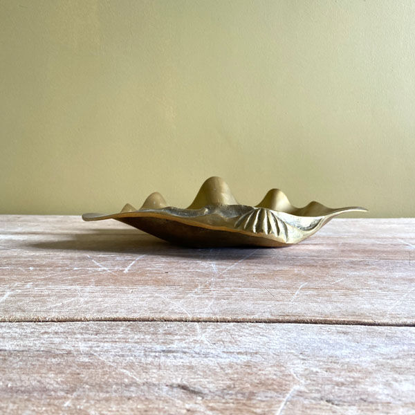 Large empty pocket in the shape of a golden brass shell