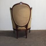 Fauteuil bergère médaillon Louis XVI en noyer tissus en petit point de croix