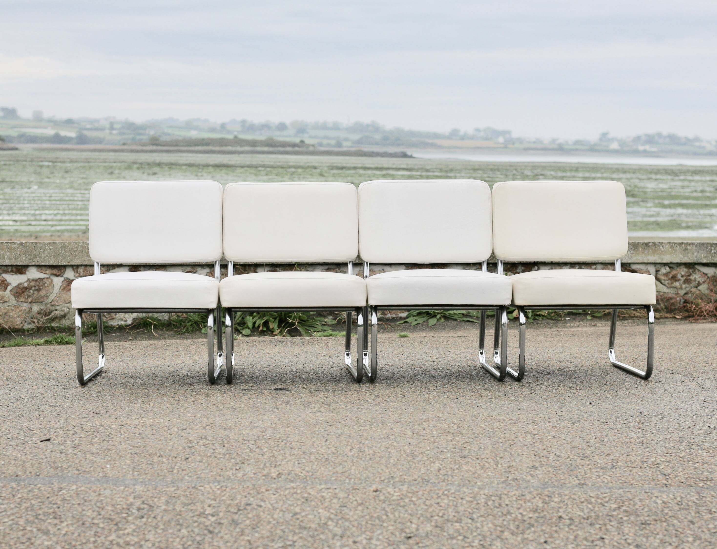 4 armchairs forming a modular sofa. Steel, imitation leather, 70s