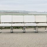 4 chauffeuses formant canapé modulable. acier, simili-cuir, années 70